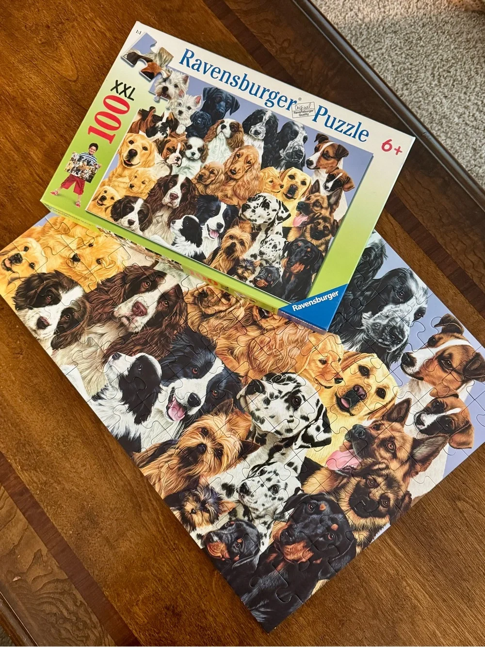 EUC Ravensburger 100-piece puzzle featuring various dog breeds - Fun!